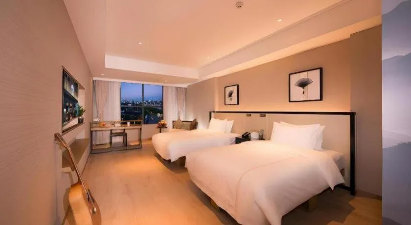 Bed in The Hotel V Nanjing Confucius Temple