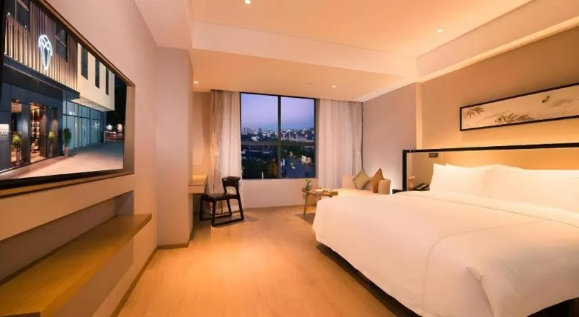 Bed in The Hotel V Nanjing Confucius Temple