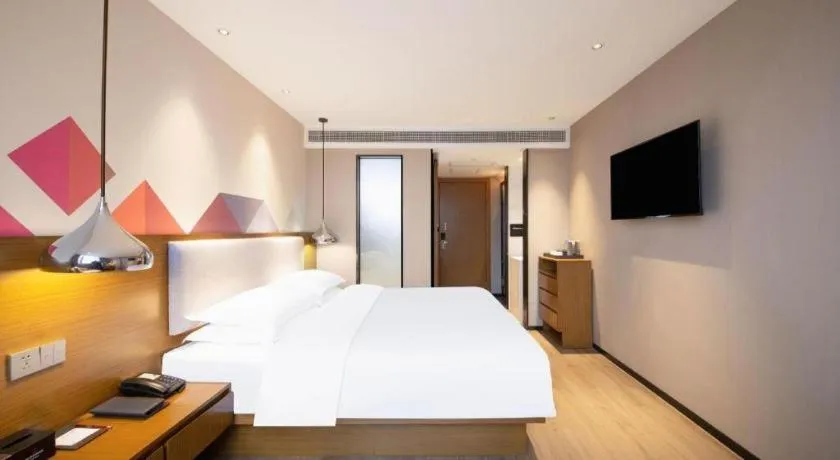 Bed in Borrman Hotel Zhanjiang Wuchuan Jinsha Plaza