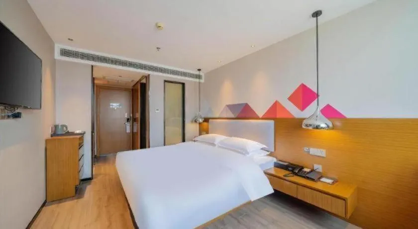 Bed in Borrman Hotel Zhanjiang Wuchuan Jinsha Plaza