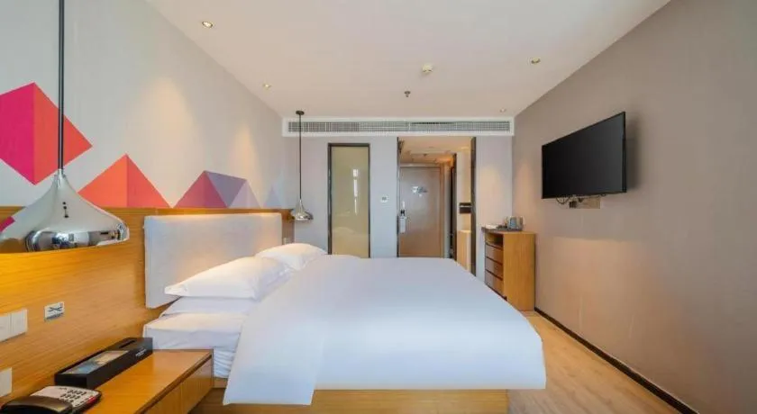 Bed in Borrman Hotel Zhanjiang Wuchuan Jinsha Plaza