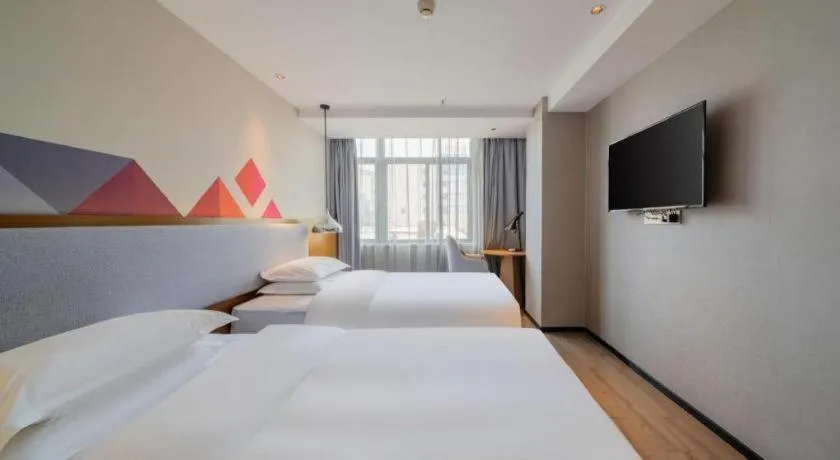 Bed in Borrman Hotel Zhanjiang Wuchuan Jinsha Plaza