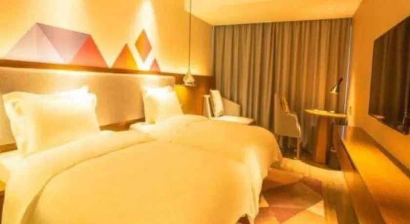 Bed in Borrman Hotel Zhanjiang Wuchuan Jinsha Plaza