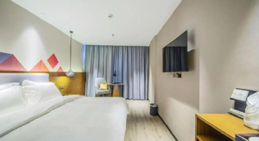Bed in Borrman Hotel Zhanjiang Wuchuan Jinsha Plaza