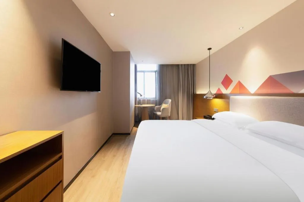 Bed in Borrman Hotel Zhanjiang Wuchuan Jinsha Plaza