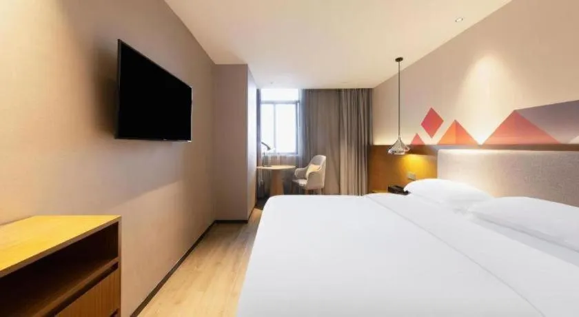 Bed in Borrman Hotel Zhanjiang Wuchuan Jinsha Plaza