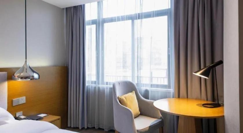 Bed in Borrman Hotel Zhanjiang Wuchuan Jinsha Plaza