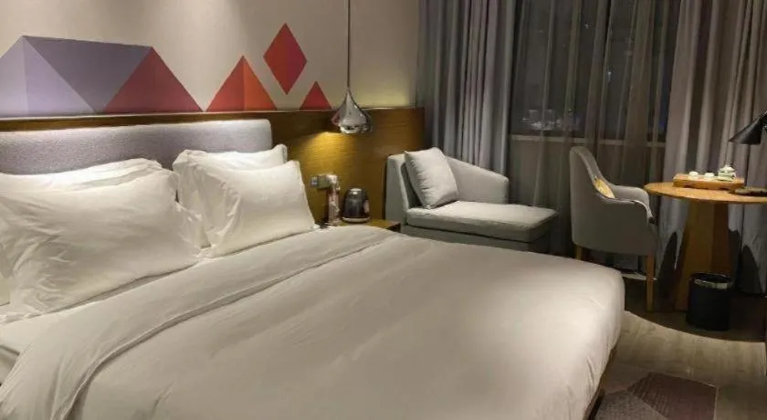 Bed in Borrman Hotel Zhanjiang Wuchuan Jinsha Plaza