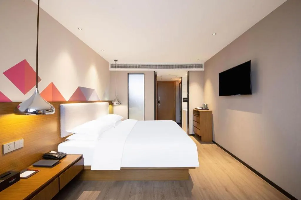Bed in Borrman Hotel Zhanjiang Wuchuan Jinsha Plaza