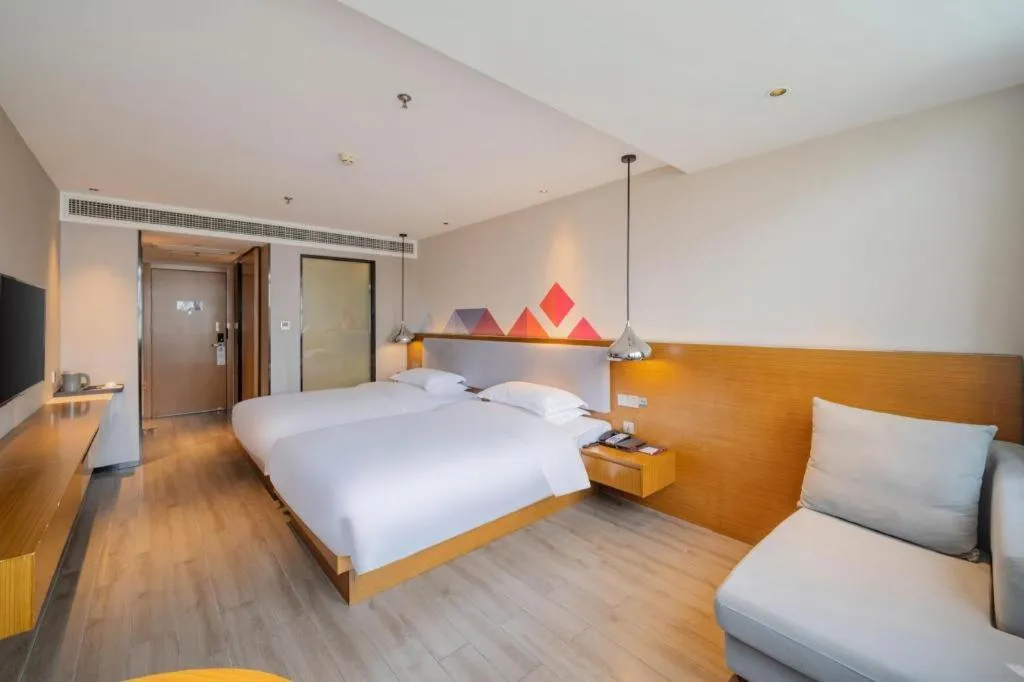 Bed in Borrman Hotel Zhanjiang Wuchuan Jinsha Plaza