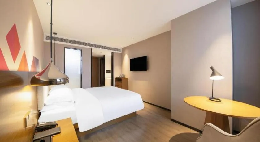 Bed in Borrman Hotel Zhanjiang Wuchuan Jinsha Plaza