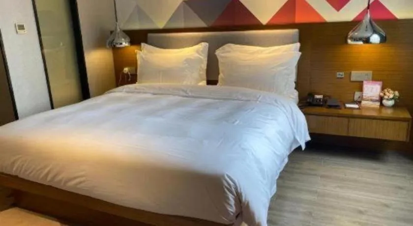 Bed in Borrman Hotel Zhanjiang Wuchuan Jinsha Plaza