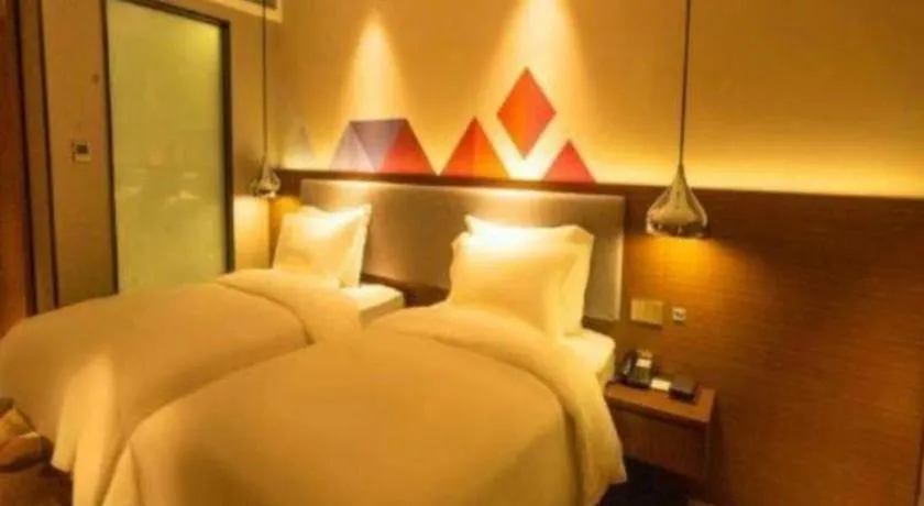 Bed in Borrman Hotel Zhanjiang Wuchuan Jinsha Plaza