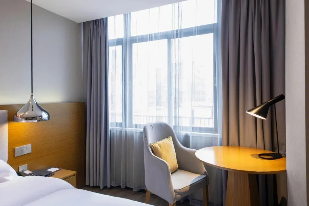 Bed in Borrman Hotel Zhanjiang Wuchuan Jinsha Plaza