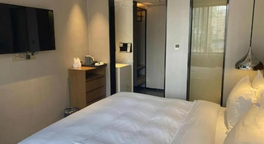 Bed in Borrman Hotel Zhanjiang Wuchuan Jinsha Plaza