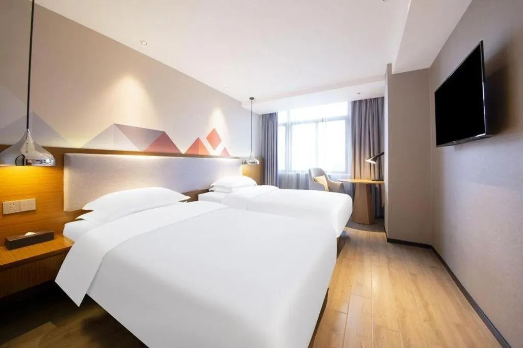 Bed in Borrman Hotel Zhanjiang Wuchuan Jinsha Plaza