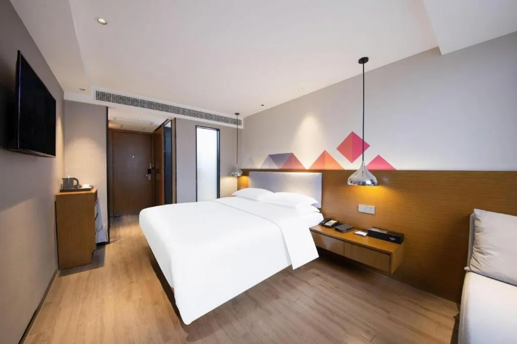 Bed in Borrman Hotel Zhanjiang Wuchuan Jinsha Plaza