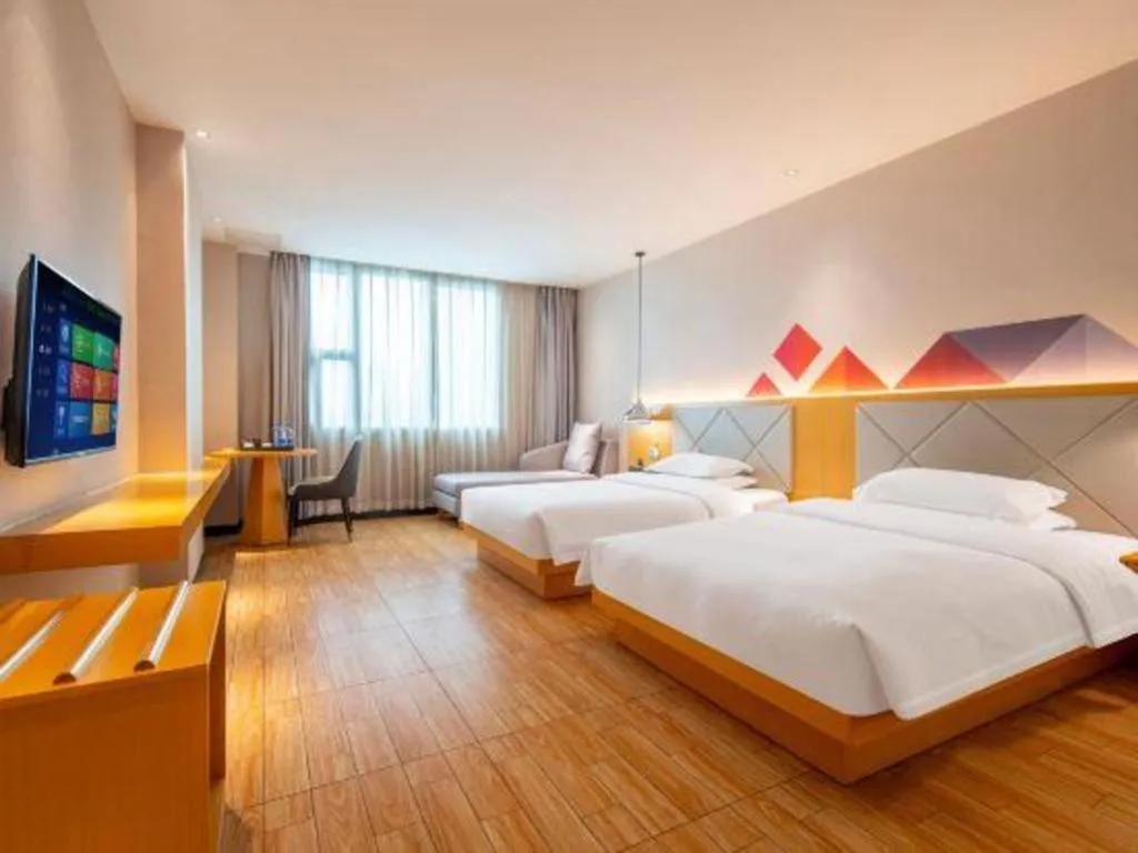 Bed in Borrman Hotel Dongguan Zhongtang