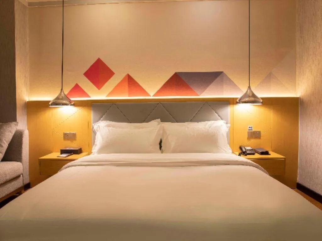 Bed in Borrman Hotel Dongguan Zhongtang