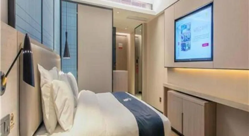 Bed in Echarm Hotel Wuhan Huangpi Xiangyang Avenue