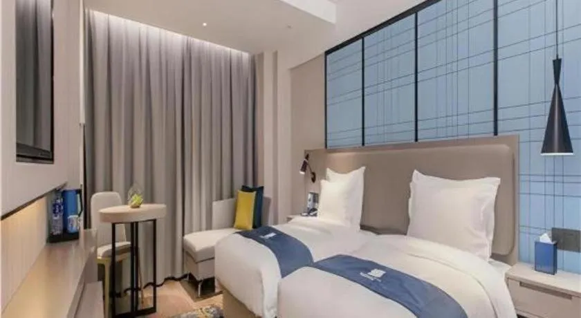 Bed in Echarm Hotel Wuhan Huangpi Xiangyang Avenue