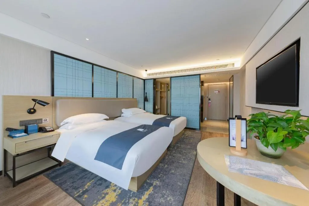 Bed in Echarm Hotel Wuhan Huangpi Xiangyang Avenue