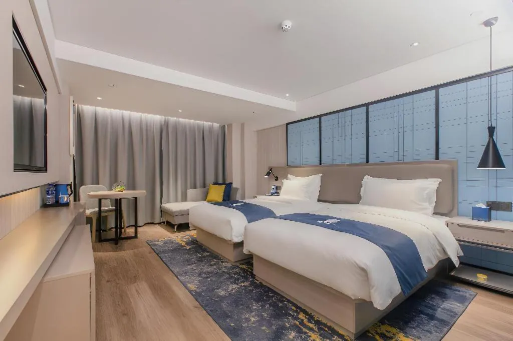 Bed in Echarm Hotel Wuhan Huangpi Xiangyang Avenue