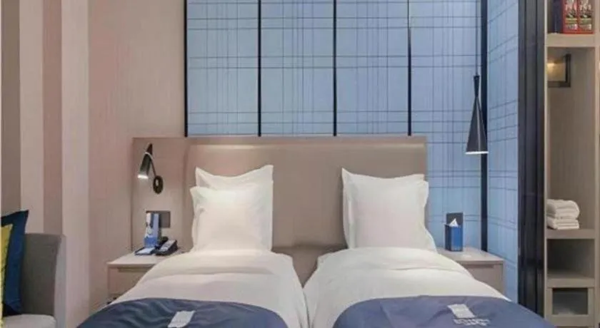 Bed in Echarm Hotel Wuhan Huangpi Xiangyang Avenue