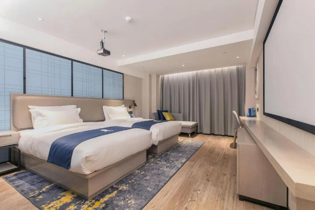 Bed in Echarm Hotel Wuhan Huangpi Xiangyang Avenue
