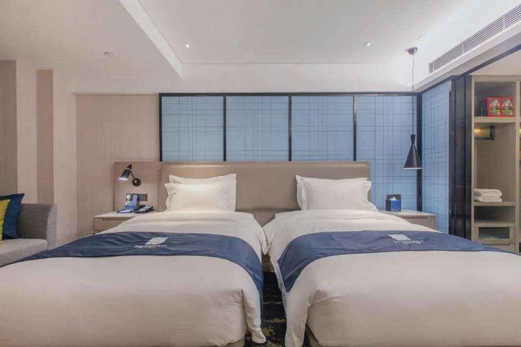 Bed in Echarm Hotel Wuhan Huangpi Xiangyang Avenue