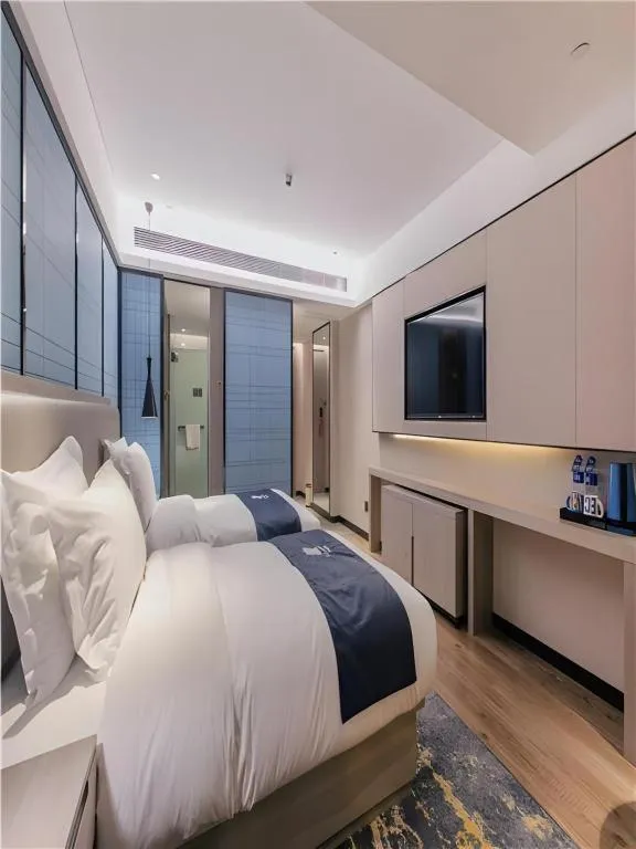 Bed in Echarm Hotel Wuhan Huangpi Xiangyang Avenue