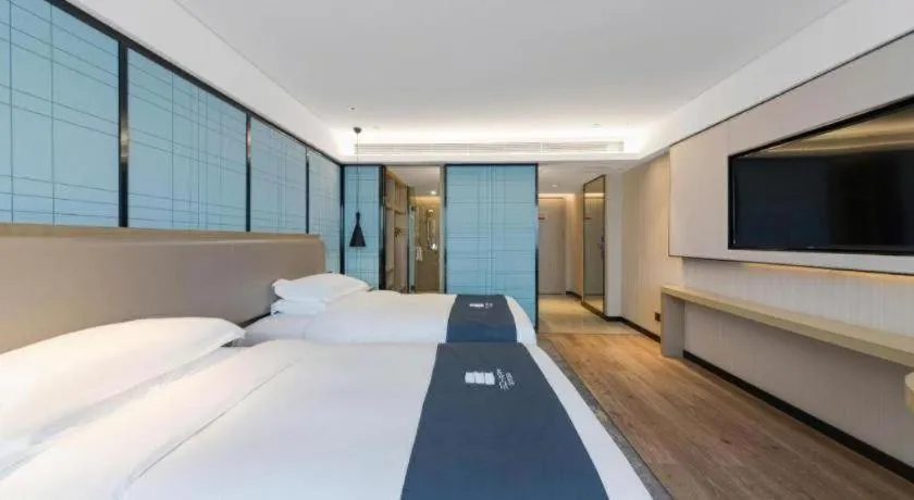 Bed in Echarm Hotel Wuhan Huangpi Xiangyang Avenue