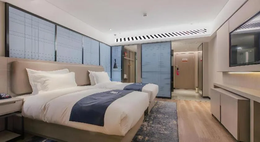 Bed in Echarm Hotel Wuhan Huangpi Xiangyang Avenue