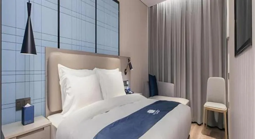 Bed in Echarm Hotel Wuhan Huangpi Xiangyang Avenue