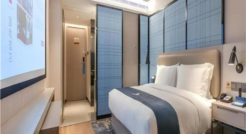 Bed in Echarm Hotel Wuhan Huangpi Xiangyang Avenue