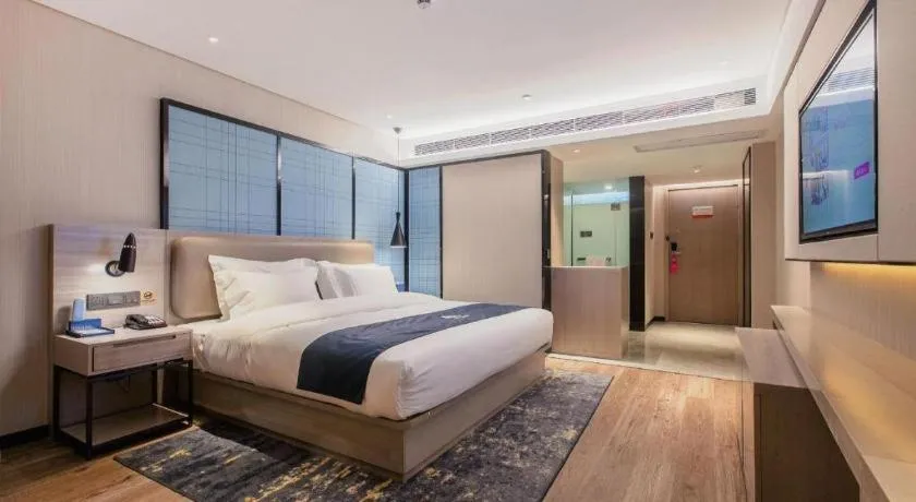 Bed in Echarm Hotel Wuhan Huangpi Xiangyang Avenue