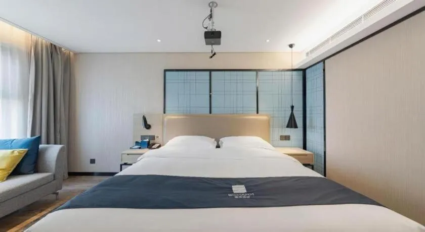 Bed in Echarm Hotel Wuhan Huangpi Xiangyang Avenue
