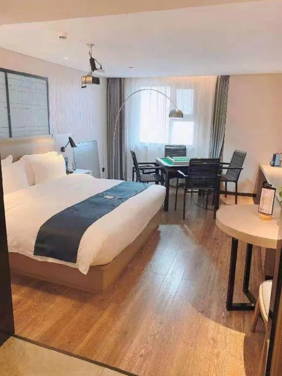 Bed in Echarm Hotel Wuhan Huangpi Xiangyang Avenue