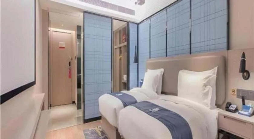 Bed in Echarm Hotel Wuhan Huangpi Xiangyang Avenue