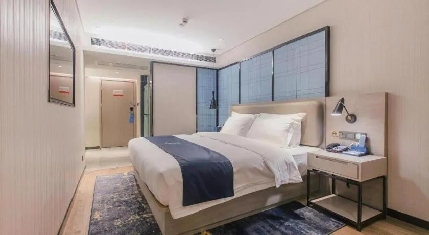 Bed in Echarm Hotel Wuhan Huangpi Xiangyang Avenue