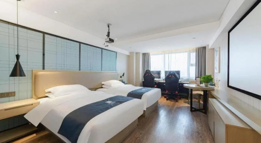Bed in Echarm Hotel Wuhan Huangpi Xiangyang Avenue
