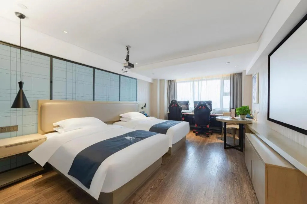 Bed in Echarm Hotel Wuhan Huangpi Xiangyang Avenue