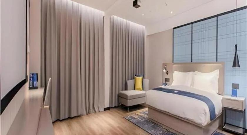 Bed in Echarm Hotel Wuhan Huangpi Xiangyang Avenue