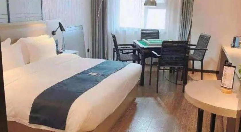 Bed in Echarm Hotel Wuhan Huangpi Xiangyang Avenue
