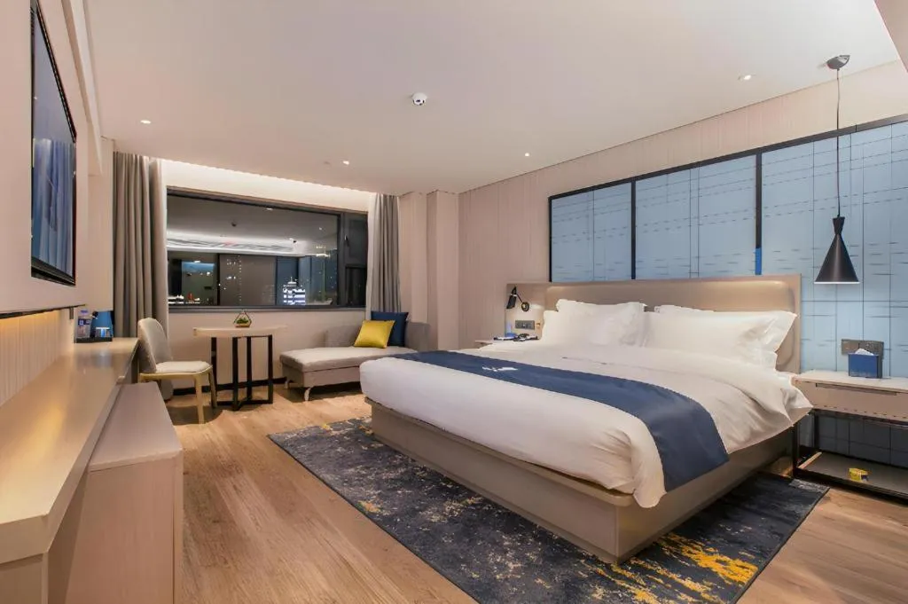 Bed in Echarm Hotel Wuhan Huangpi Xiangyang Avenue