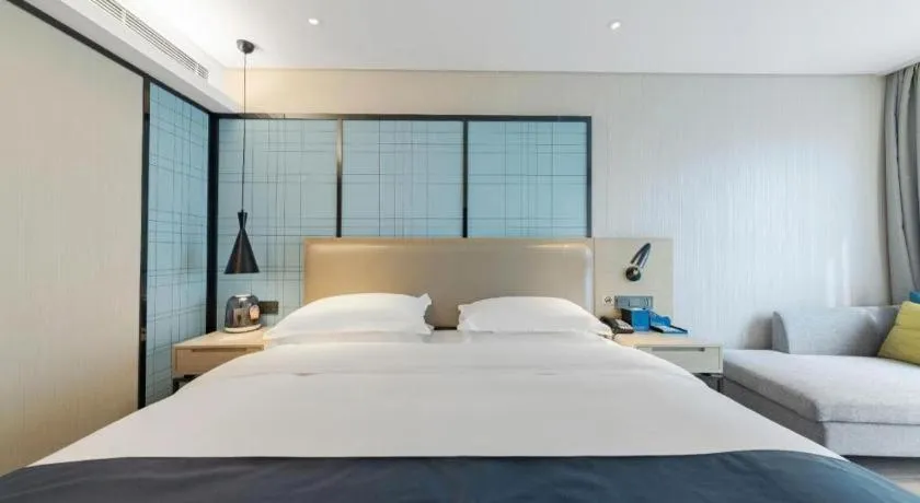 Bed in Echarm Hotel Wuhan Huangpi Xiangyang Avenue