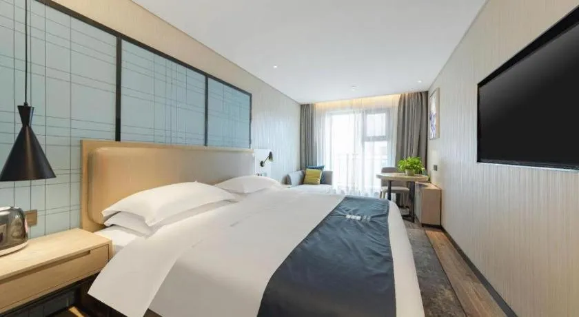 Bed in Echarm Hotel Wuhan Huangpi Xiangyang Avenue