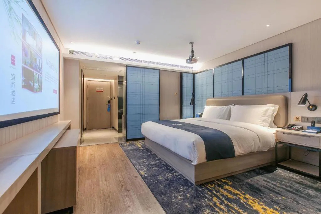 Bed in Echarm Hotel Wuhan Huangpi Xiangyang Avenue