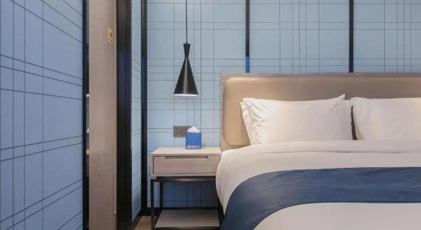 Bed in Echarm Hotel Wuhan Huangpi Xiangyang Avenue