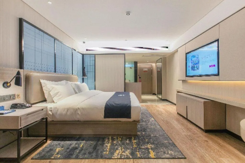 Bed in Echarm Hotel Wuhan Huangpi Xiangyang Avenue